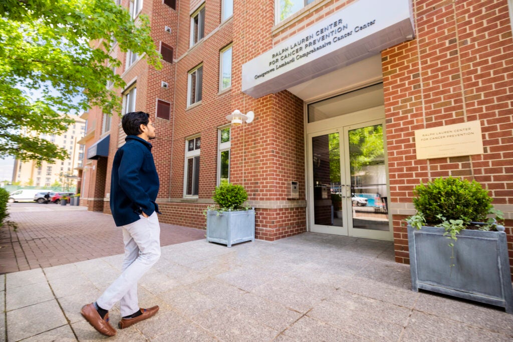 Man walking into the Ralph Lauren Center for Cancer Prevention